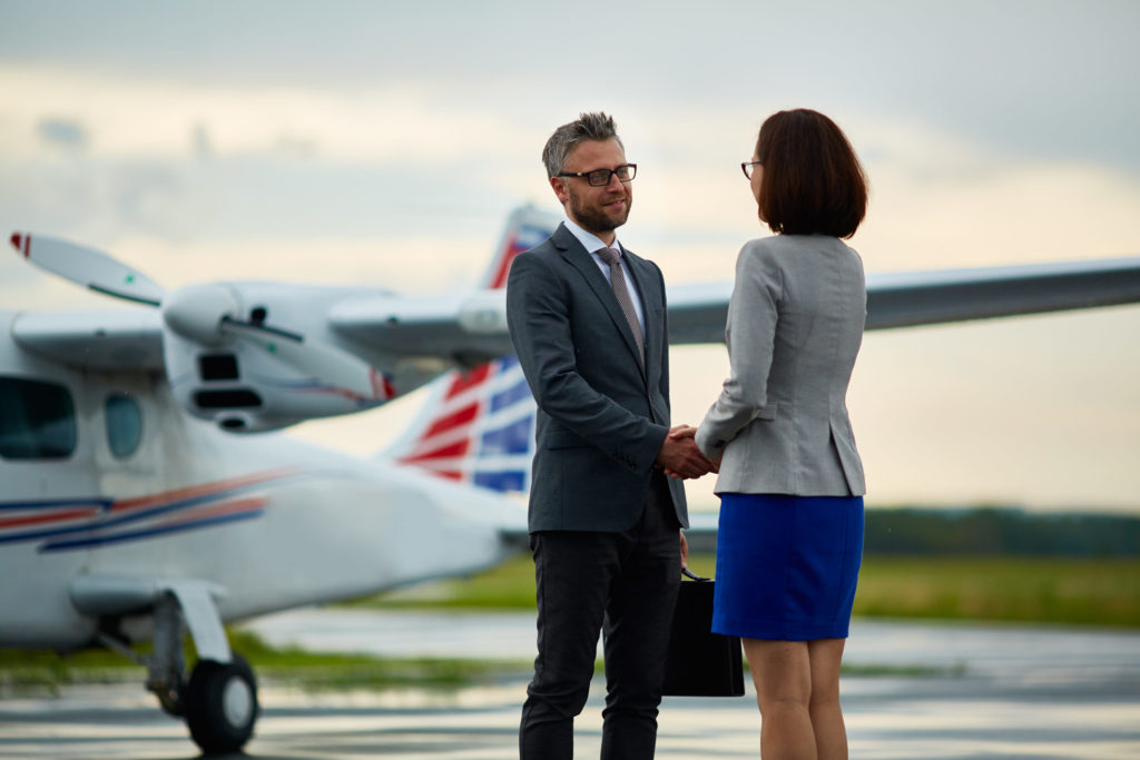 man and woman speaking on runway